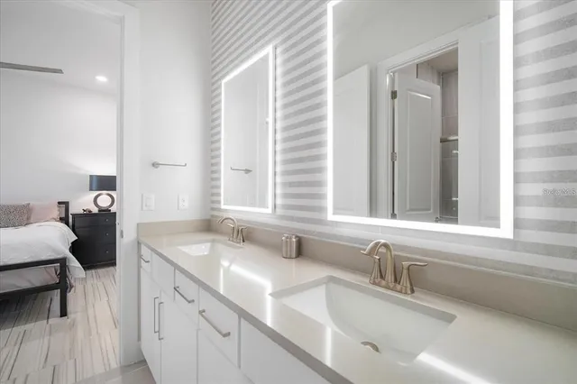 a bathroom with a sink and a window