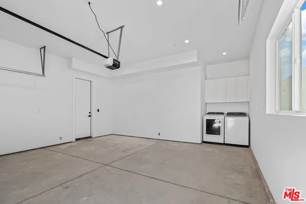 a view of a livingroom with a ceiling fan and window