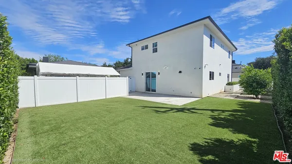 a house view with a backyard space