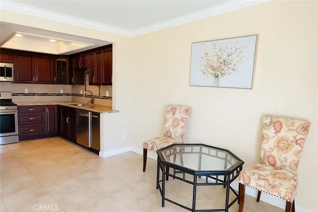 a kitchen with a stove a sink and a refrigerator