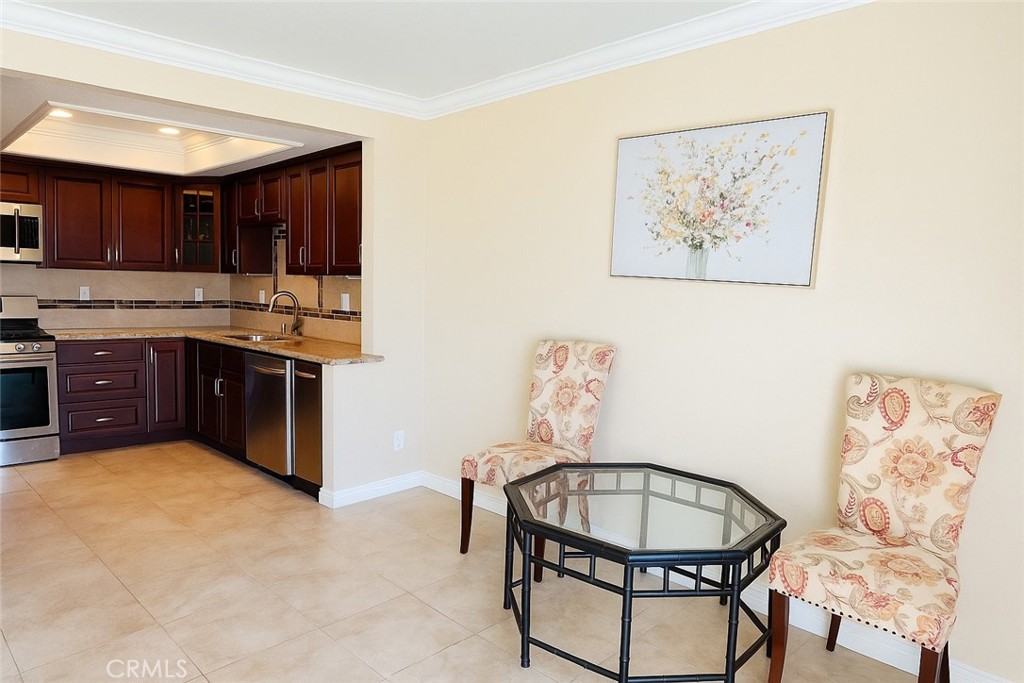 24612 Harbor View Drive, Unit 55C Dana Point, CA 92629 - Photo 7 of 17 a kitchen with a stove a sink and a refrigerator