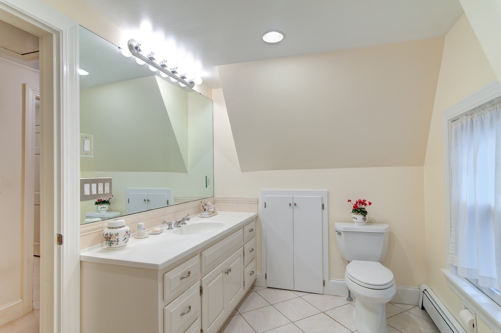 61 Silver Hill Road Weston, MA 02493 - Photo 11 of 18 a bathroom with a sink a toilet and a mirror
