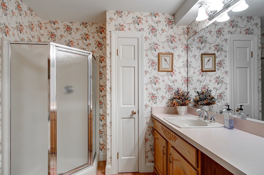 61 Silver Hill Road Weston, MA 02493 - Photo 17 of 18 a bathroom with a sink vanity and a mirror