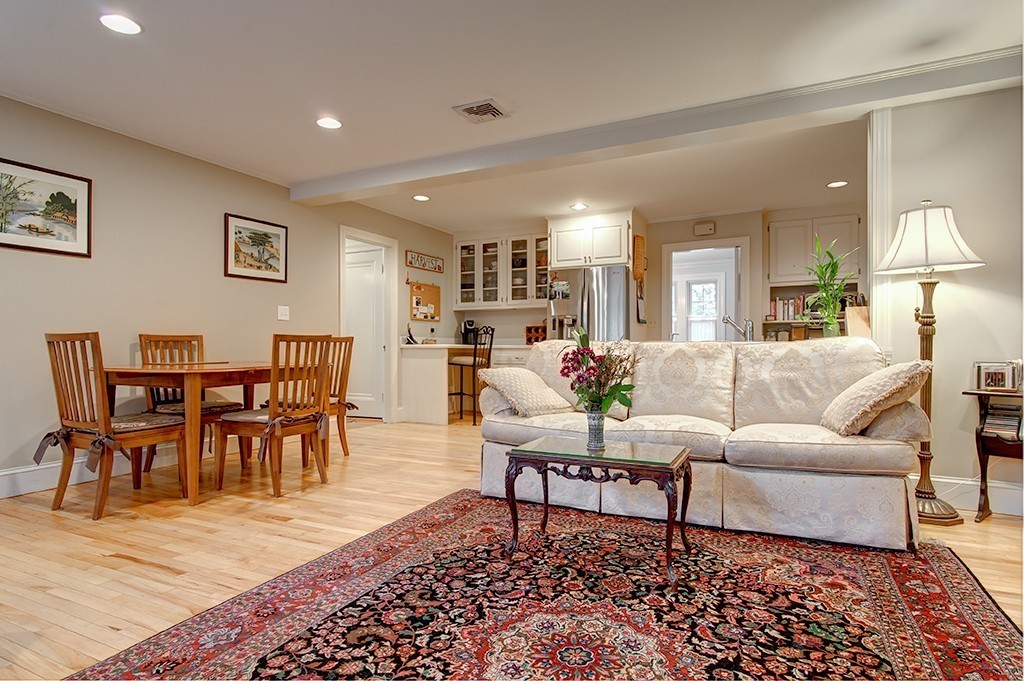 61 Silver Hill Road Weston, MA 02493 - Photo 8 of 18 a living room with furniture dining table a lamp and a window