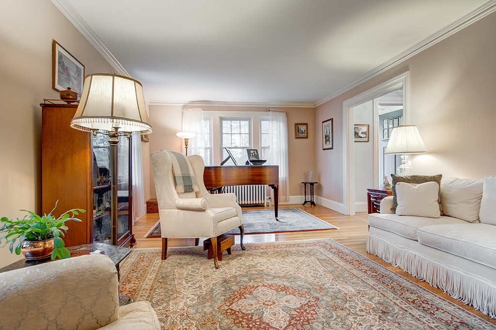 61 Silver Hill Road Weston, MA 02493 - Photo 9 of 18 a living room with furniture fireplace and a window