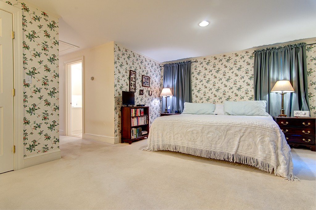 61 Silver Hill Road Weston, MA 02493 - Photo 10 of 18 a bedroom with a bed and a painting on the wall