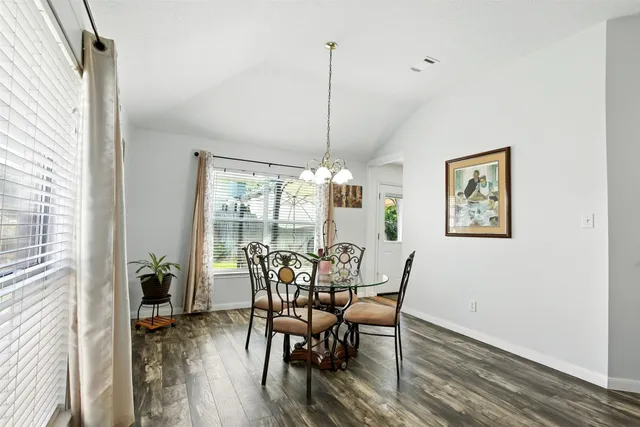a kitchen with a refrigerator and a stove top oven