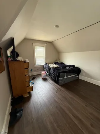 a room with gym equipment and a wooden floor