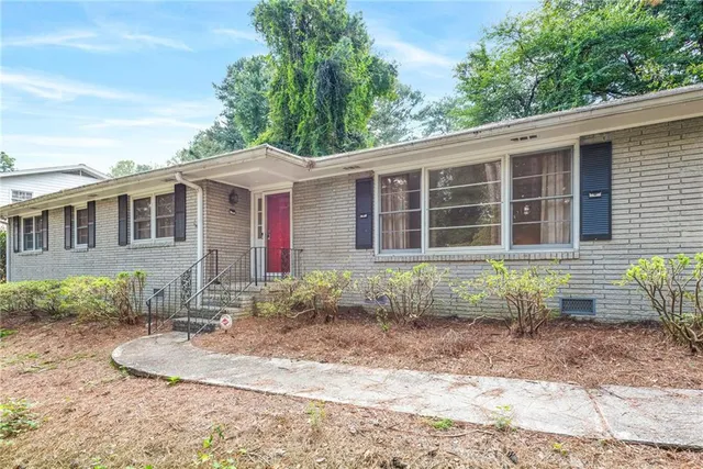 a front view of a house with garden