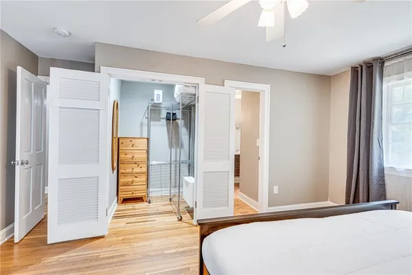 a view of empty room with wooden floor