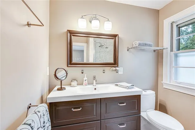 a bathroom with a shower and a sink