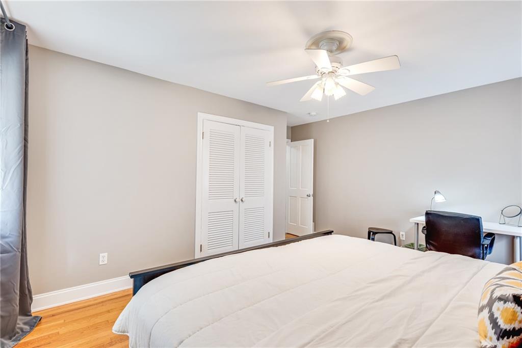 1973 Desmond Drive Decatur, GA 30033 - Photo 22 of 38 a bedroom with a bed and a chandelier