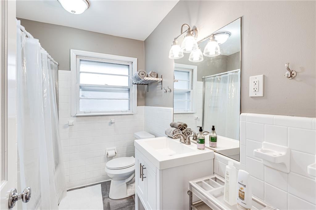 1973 Desmond Drive Decatur, GA 30033 - Photo 23 of 38 a bathroom with a sink a toilet and a mirror