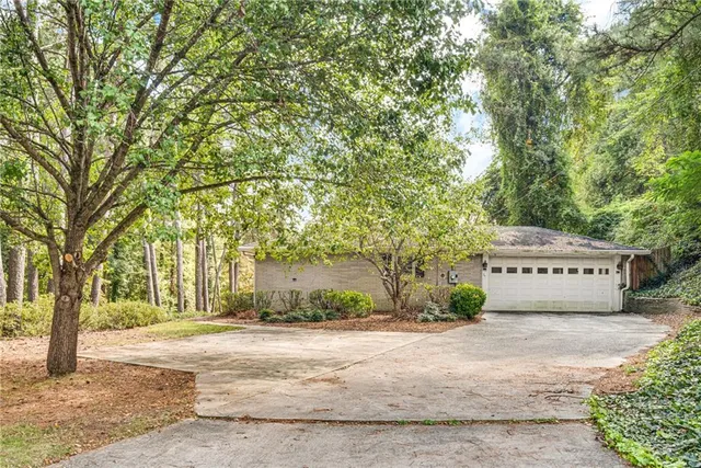 a backyard of a house with a tree