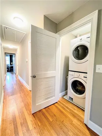 a view of a hallway with washer and dryer