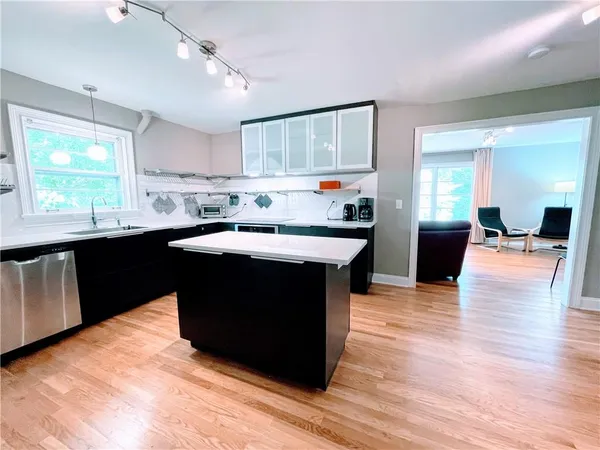 a kitchen with a sink and cabinets