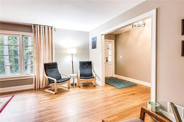 a room with wooden floor and furniture