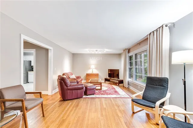 a living room with furniture and a table