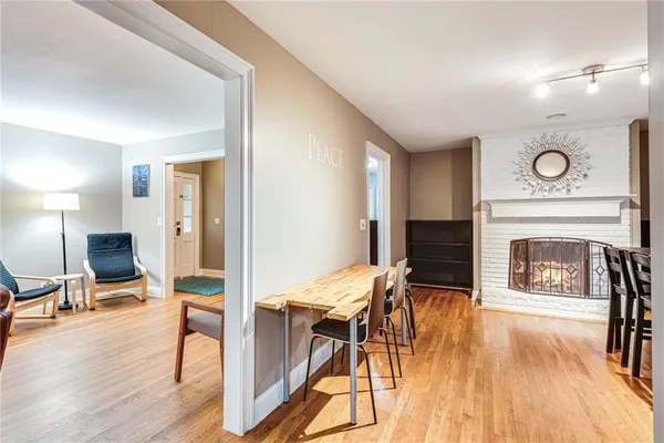 a view of a livingroom with furniture and a fireplace