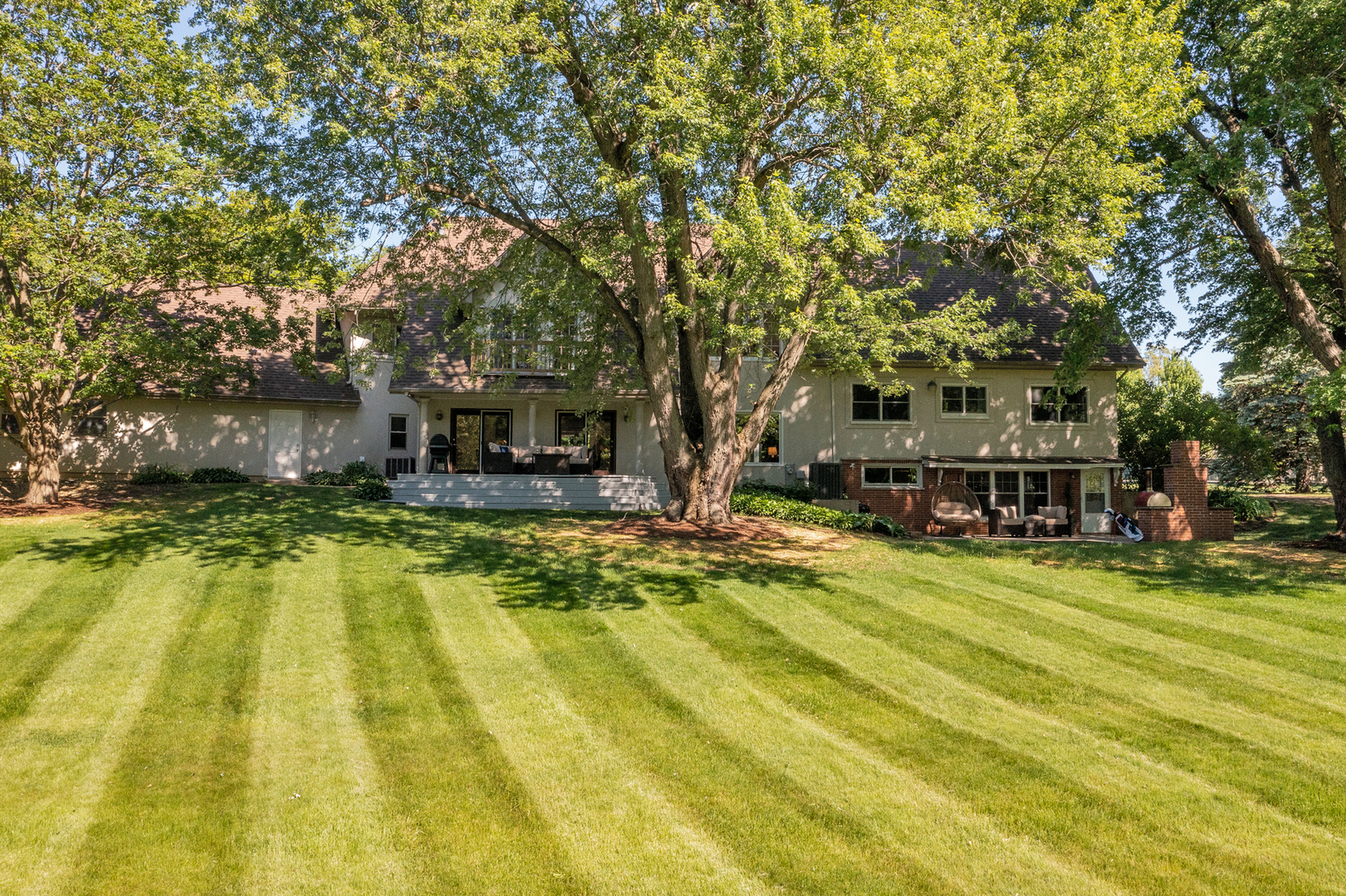 144 North Highland Road Inverness, IL 60067 - Photo 34 of 49 a view of a swimming pool with lawn chairs and plants