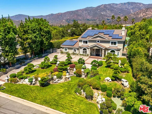a dining room with furniture entryway and wooden floor