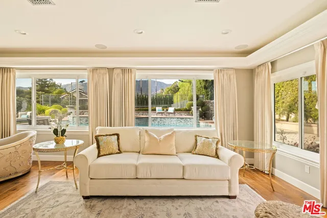 a dining room with furniture window and outside view