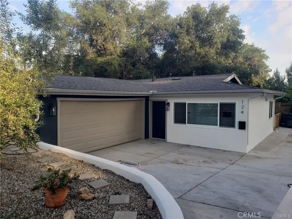 a front view of a house with a garage