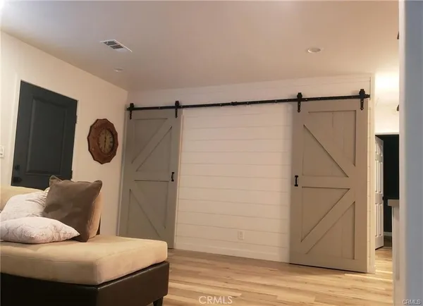 a living room with furniture and a gate