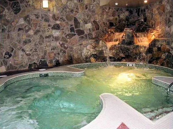 a view of a swimming pool with a yard