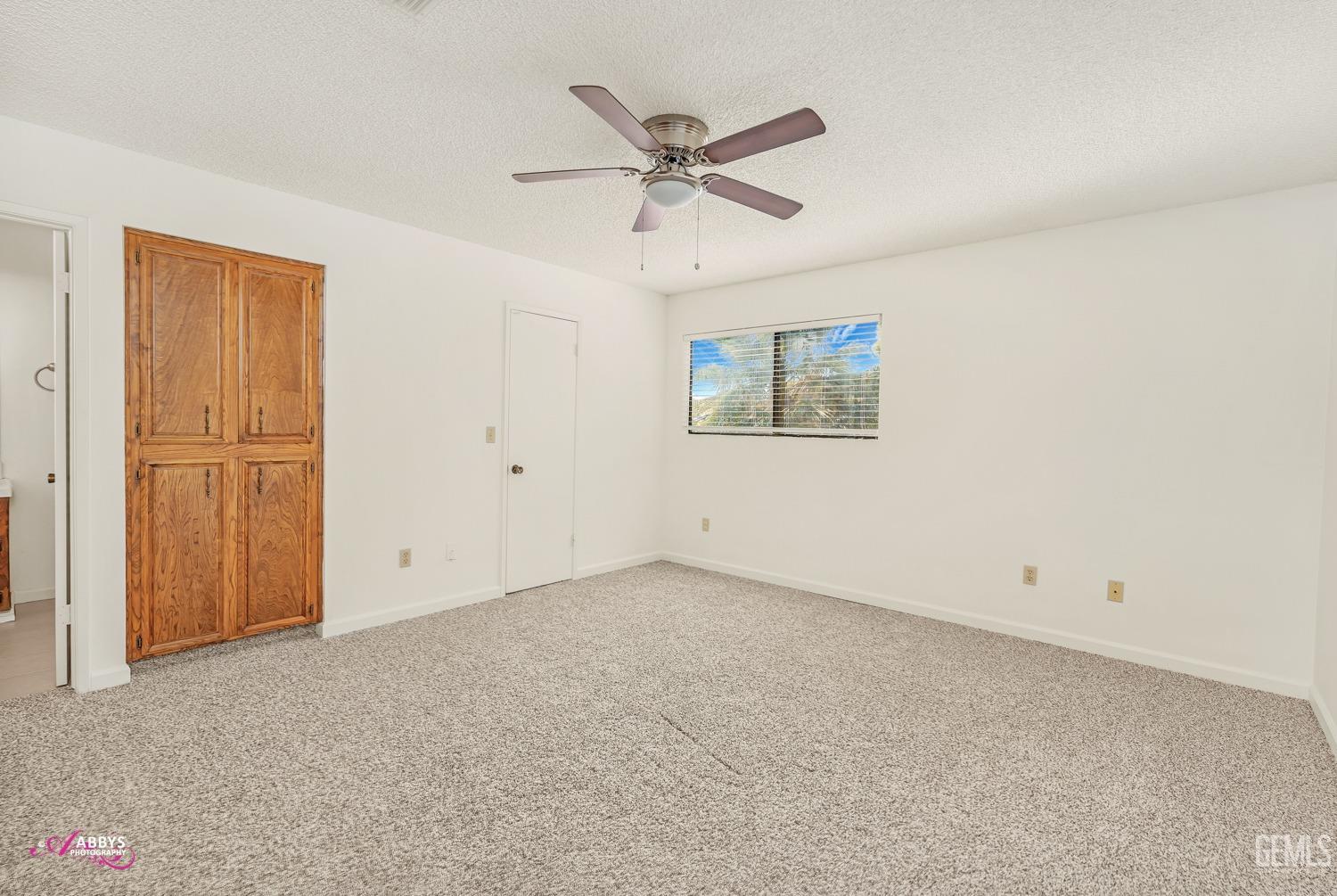 Undisclosed Address Taft, CA 93268 - Photo 24 of 46 Primary bedroom - new carpet & blinds; fan