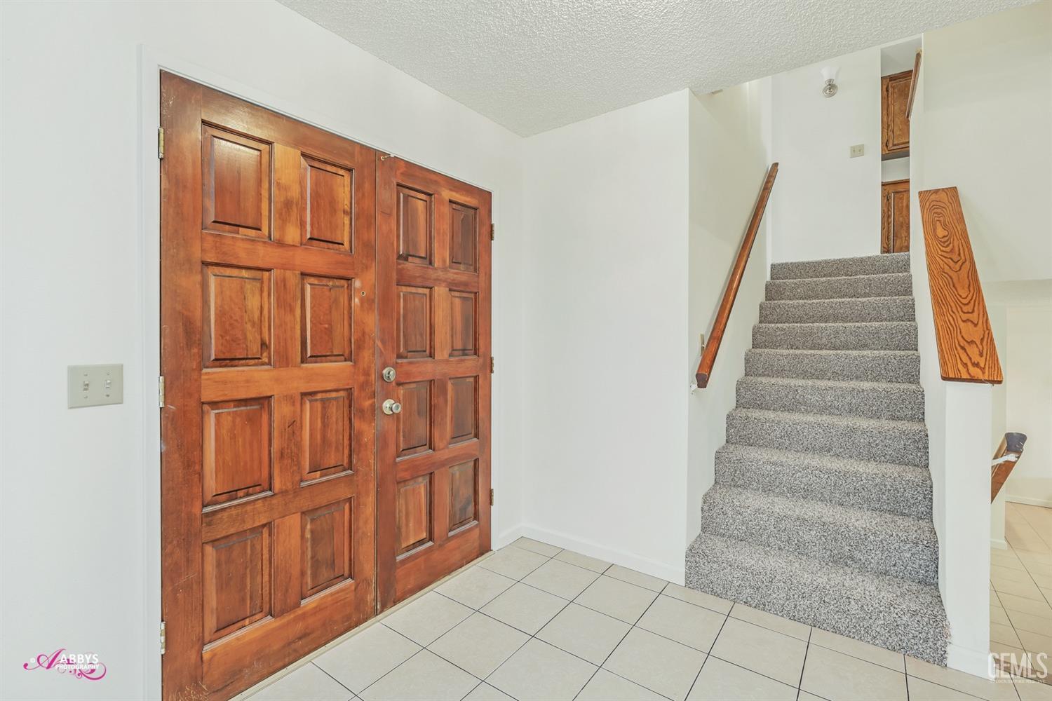 Undisclosed Address Taft, CA 93268 - Photo 10 of 46 Double door entry - stairs to upstairs with new carpet