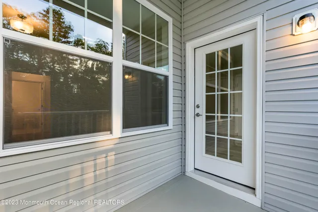 a view of a house with a swimming pool and a yard