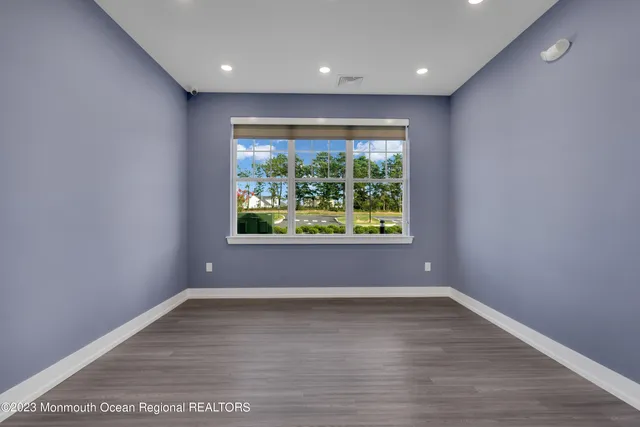 a room with gym equipment and a large window