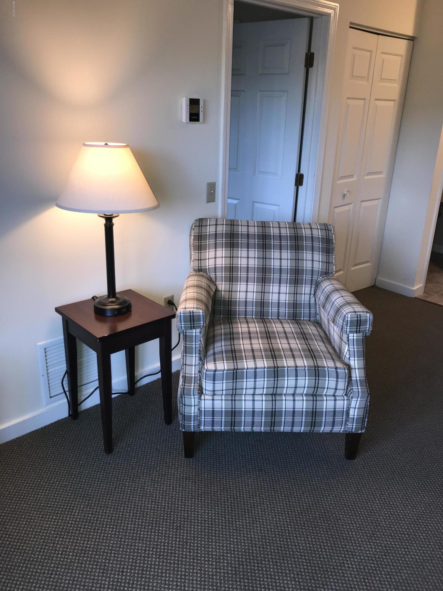 37 Corey Road, Unit 514 Hancock, MA 01237 - Photo 7 of 18 a bedroom with bed and lamp