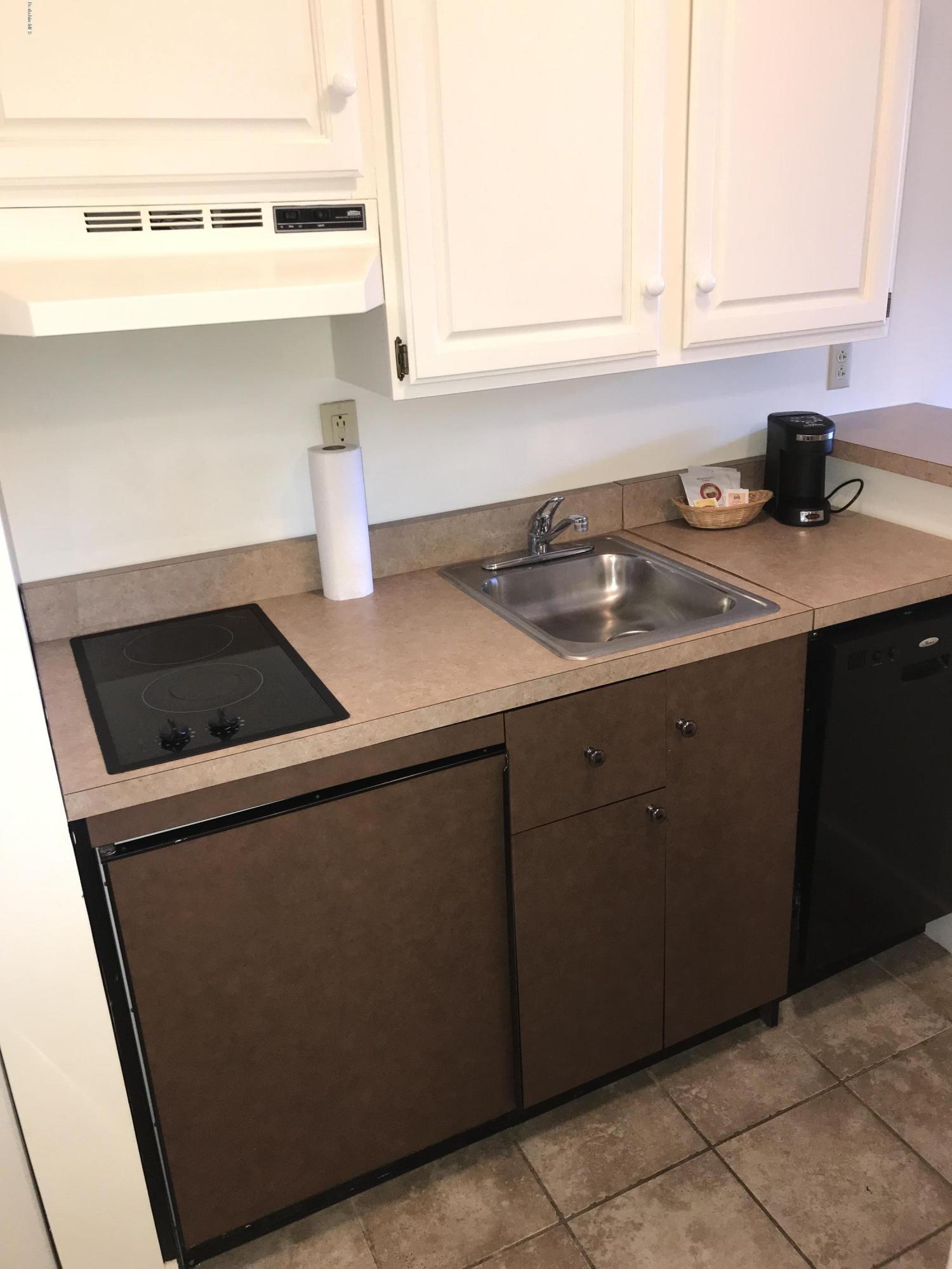 37 Corey Road, Unit 514 Hancock, MA 01237 - Photo 9 of 18 a kitchen with a sink and cabinets