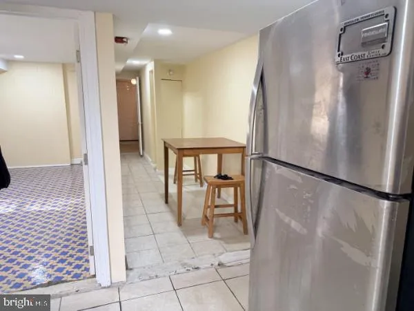 a view of a kitchen from the hallway