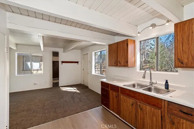 a kitchen with sink and window