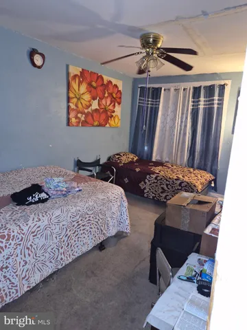 a bedroom with bed and a window