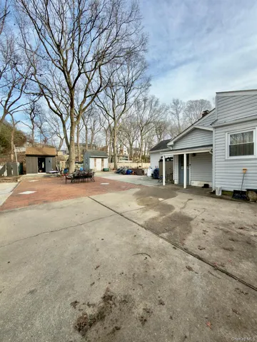 a view of patio with a yard