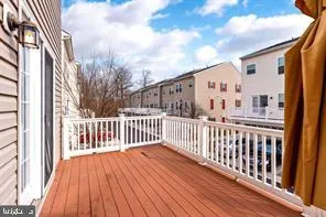 a view of a balcony with wooden floor