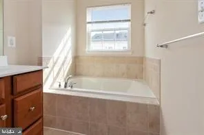 a bath tub sitting next to a window