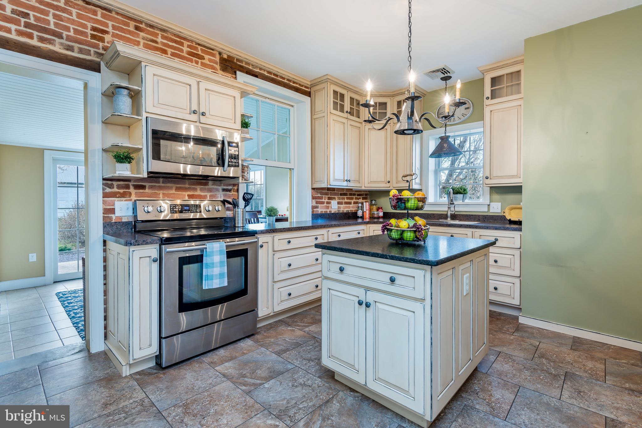 676 Lindsey Road Boiling Springs, PA 17007 - Photo 12 of 41 Exposed brick wall and stainless appliances
