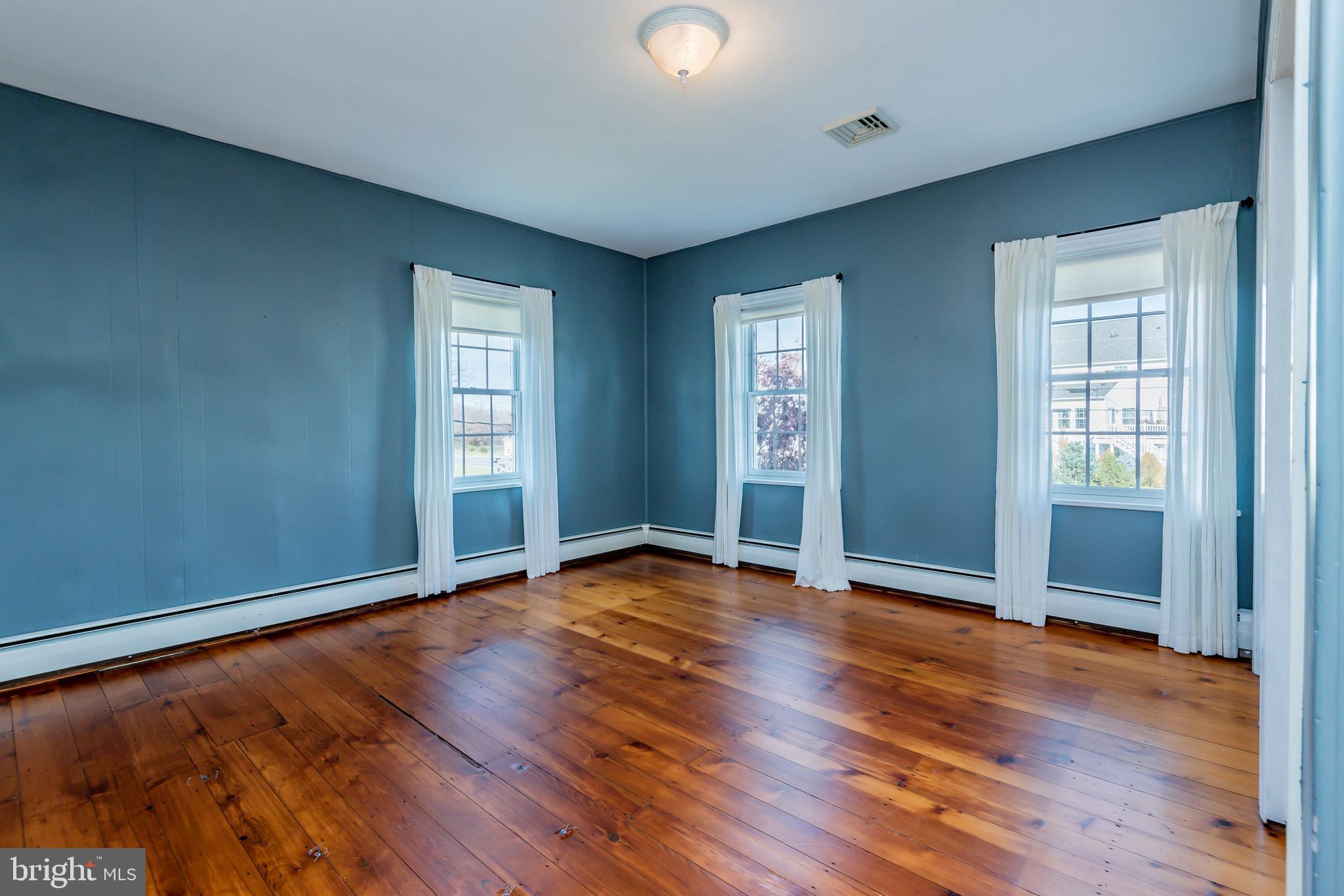 676 Lindsey Road Boiling Springs, PA 17007 - Photo 20 of 41 Roomy master bedroom with original hardwood floors
