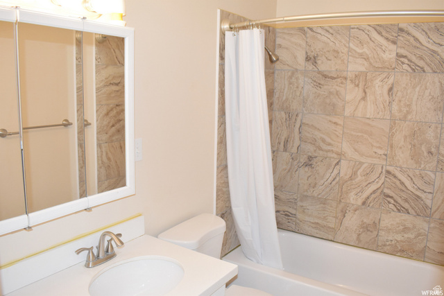 490 Averett Avenue Springville, UT 84663 - Photo 12 of 14 Bathroom featuring a shower/tub combination with patterned wall tiles