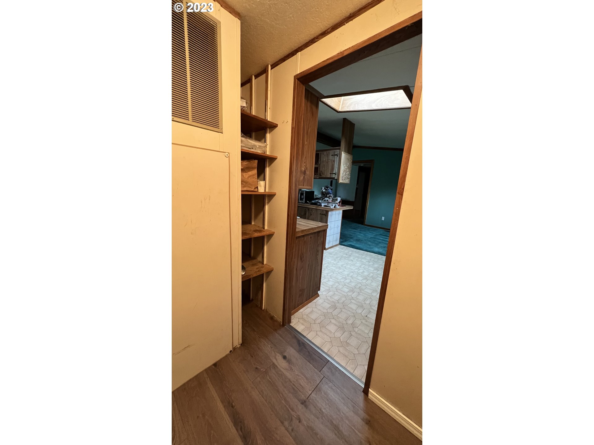 1236 South Toutle Road Toutle, WA 98649 - Photo 30 of 39 a view of a hallway with wooden floor and a bathroom