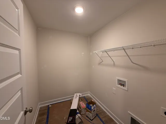 a view of a storage & utility room with racks on the wall