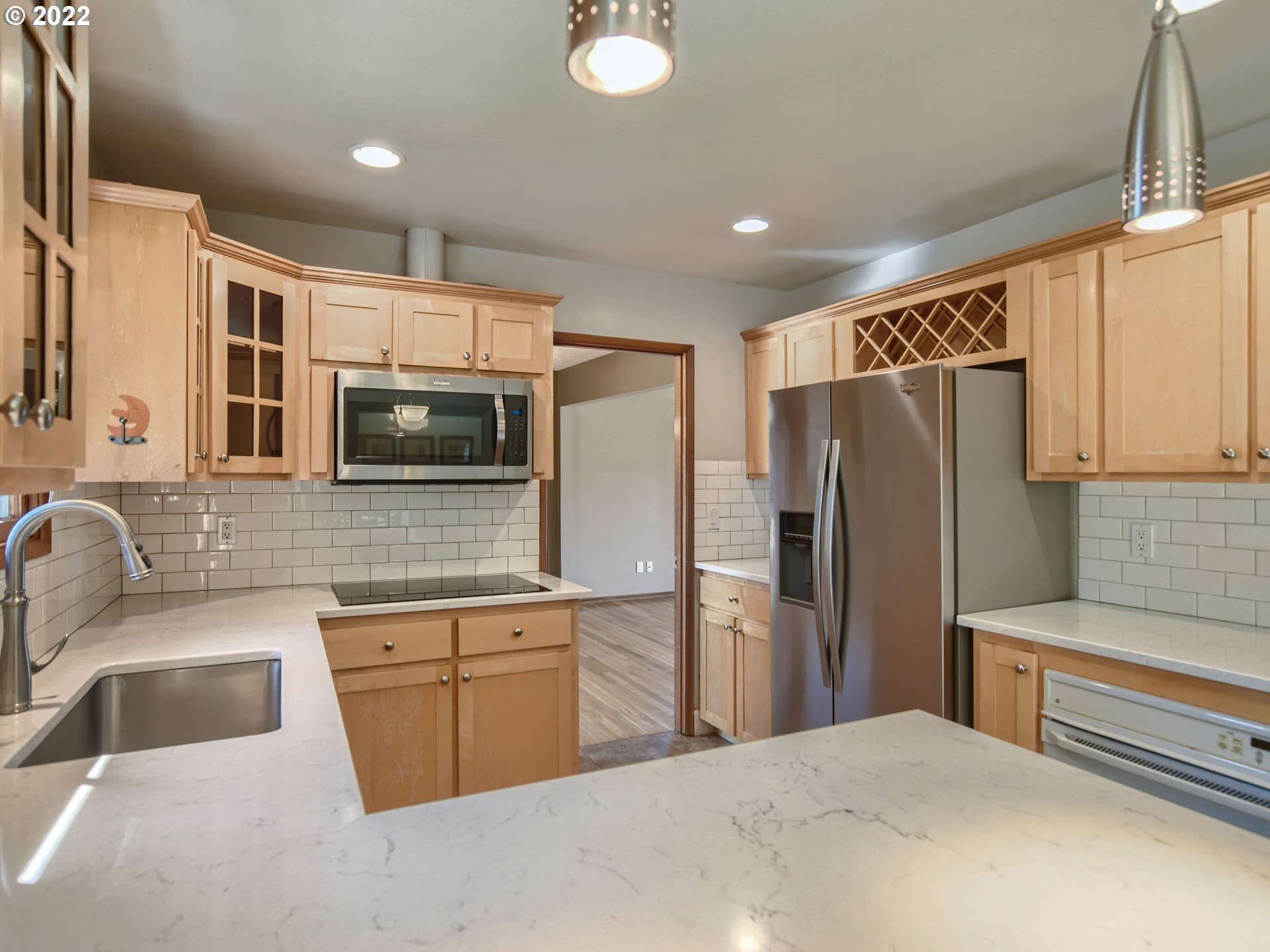10920 Southeast Clay Street Portland, OR 97216 - Photo 11 of 30 a kitchen with stainless steel appliances a refrigerator sink and microwave