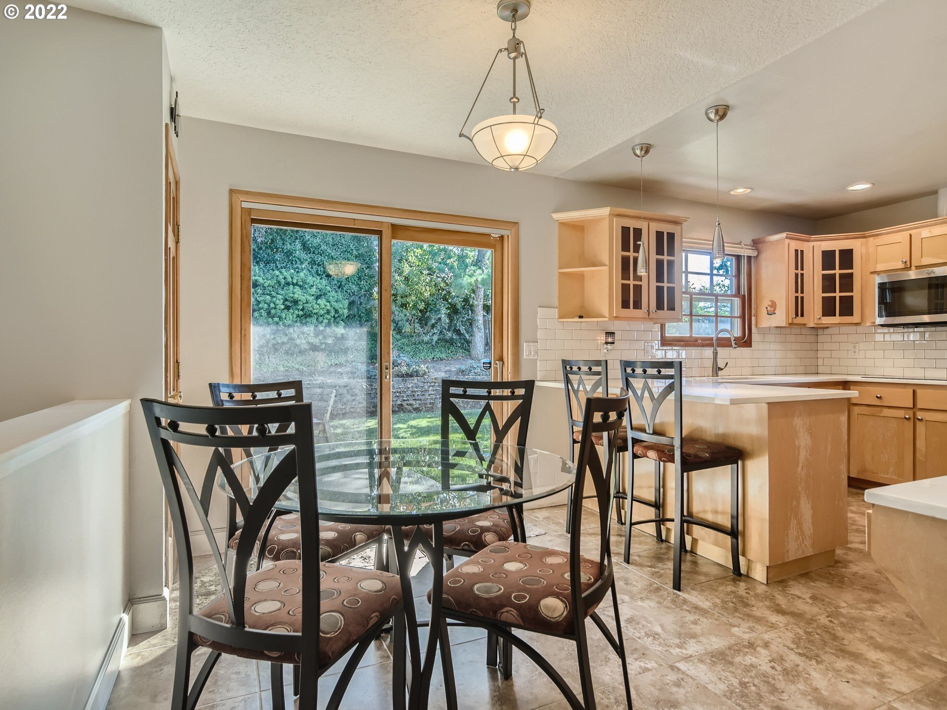 10920 Southeast Clay Street Portland, OR 97216 - Photo 12 of 30 a view of a dining room with furniture and a chandelier