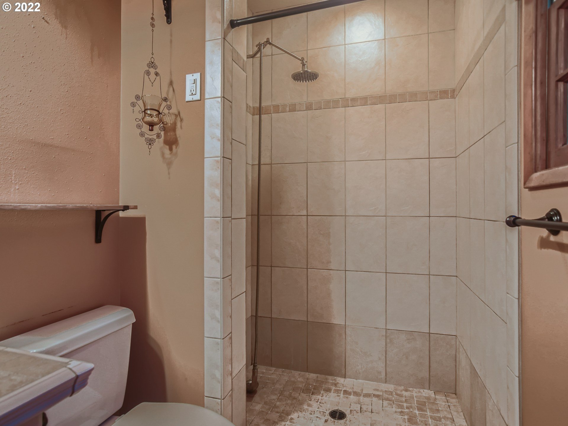 10920 Southeast Clay Street Portland, OR 97216 - Photo 15 of 30 a bathroom with a toilet and shower
