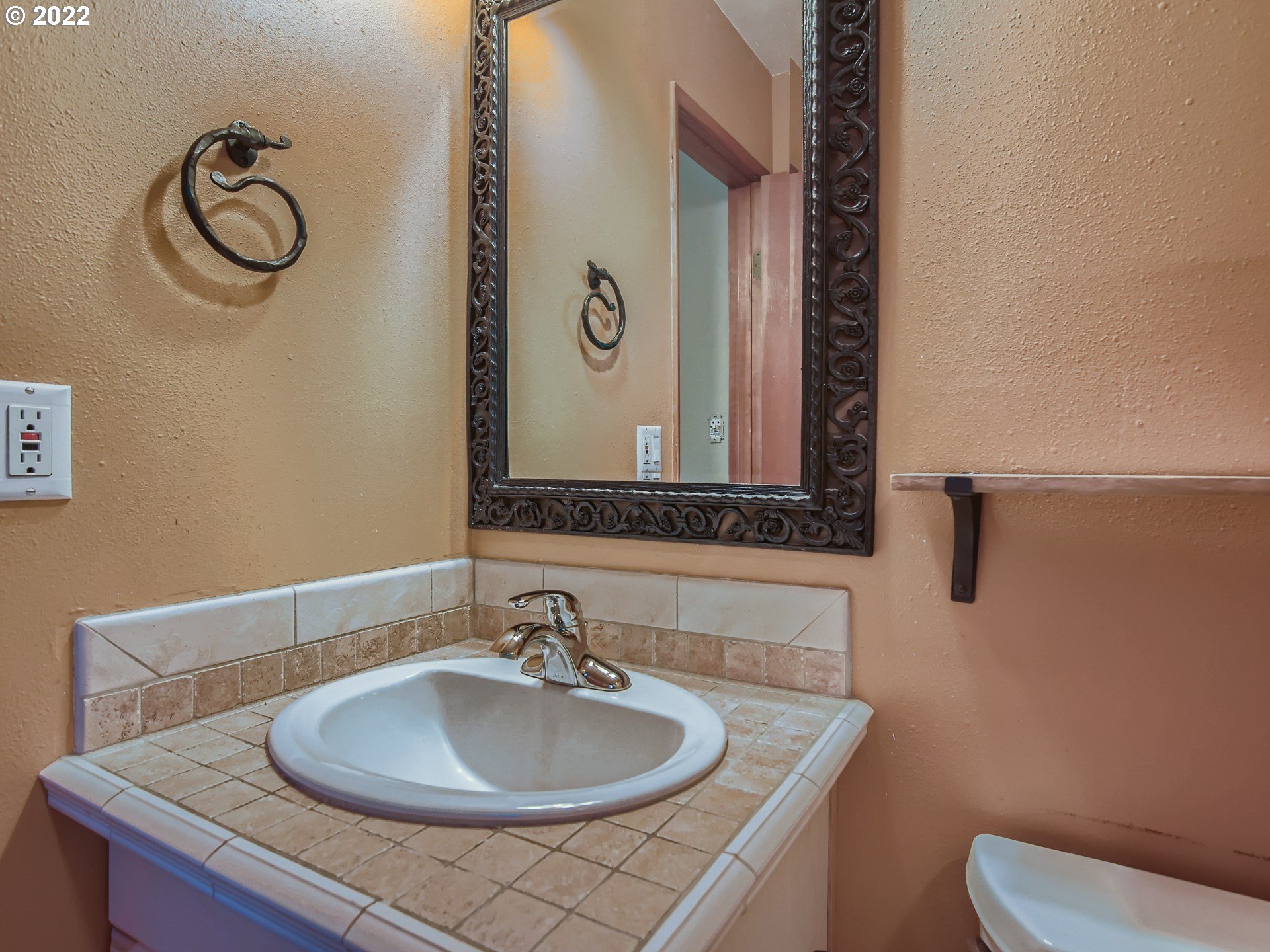 10920 Southeast Clay Street Portland, OR 97216 - Photo 16 of 30 a bathroom with a sink and a mirror